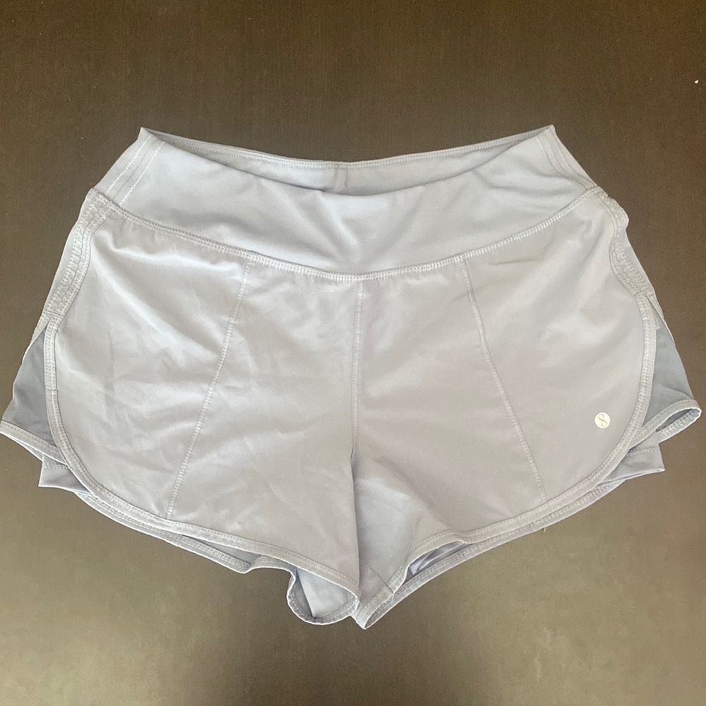 Athletic shorts with spandex inside. Size small in light blue.